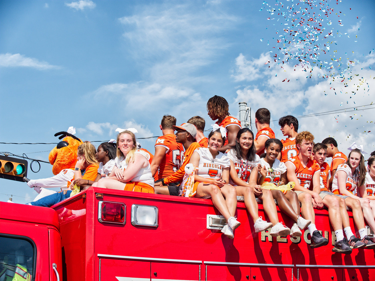 The Mineola High School Homecoming Parade made its way through downtown last Friday afternoon. Aboard a Mineola fire truck were the varsity football players and cheerleaders.